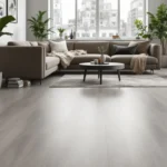Een stijlvolle woonkamer met betonlook PVC-vloer, minimalistische meubels en planten, verlicht door zacht natuurlijk licht.